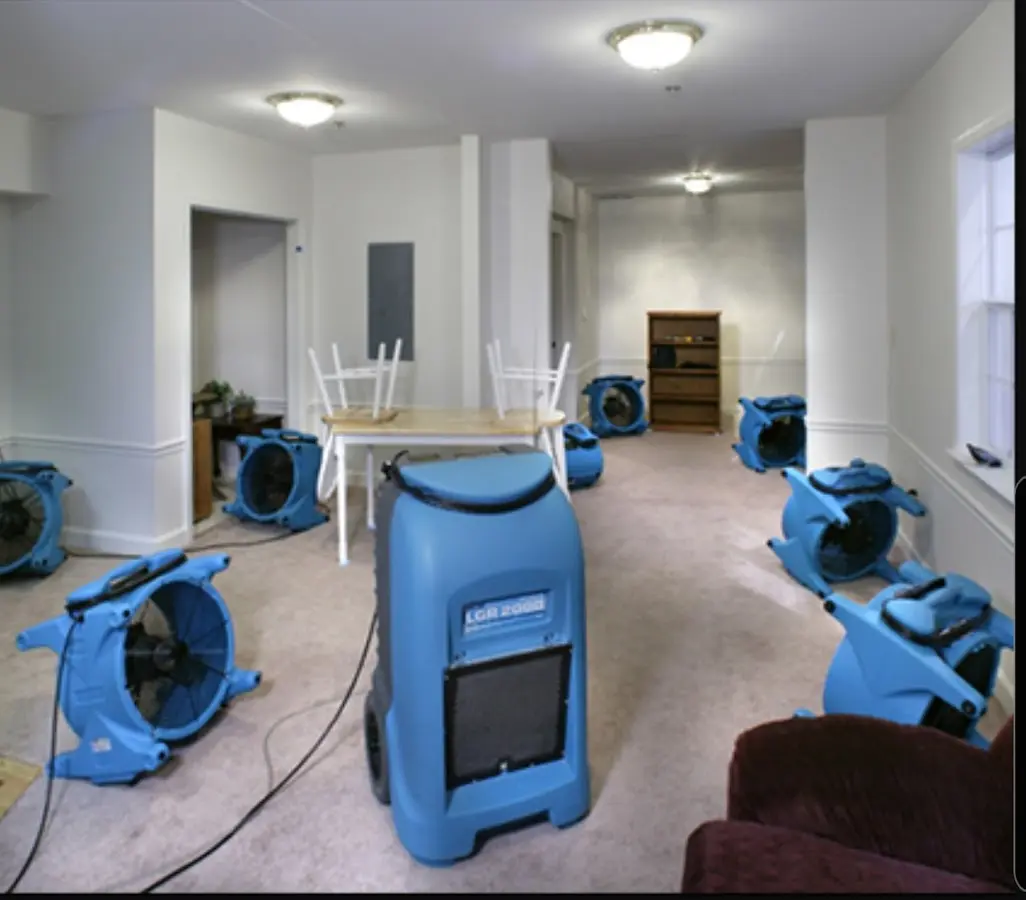 Air movers and dehumidifier setup for Water Damage Restoration in Pierre